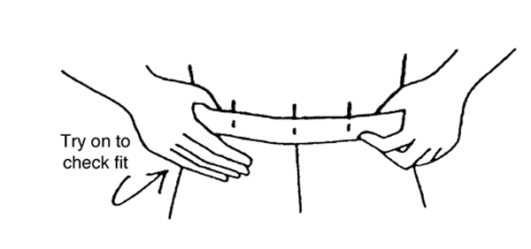 Figure 8. Trying on the garment to ensure correct waistband fit.